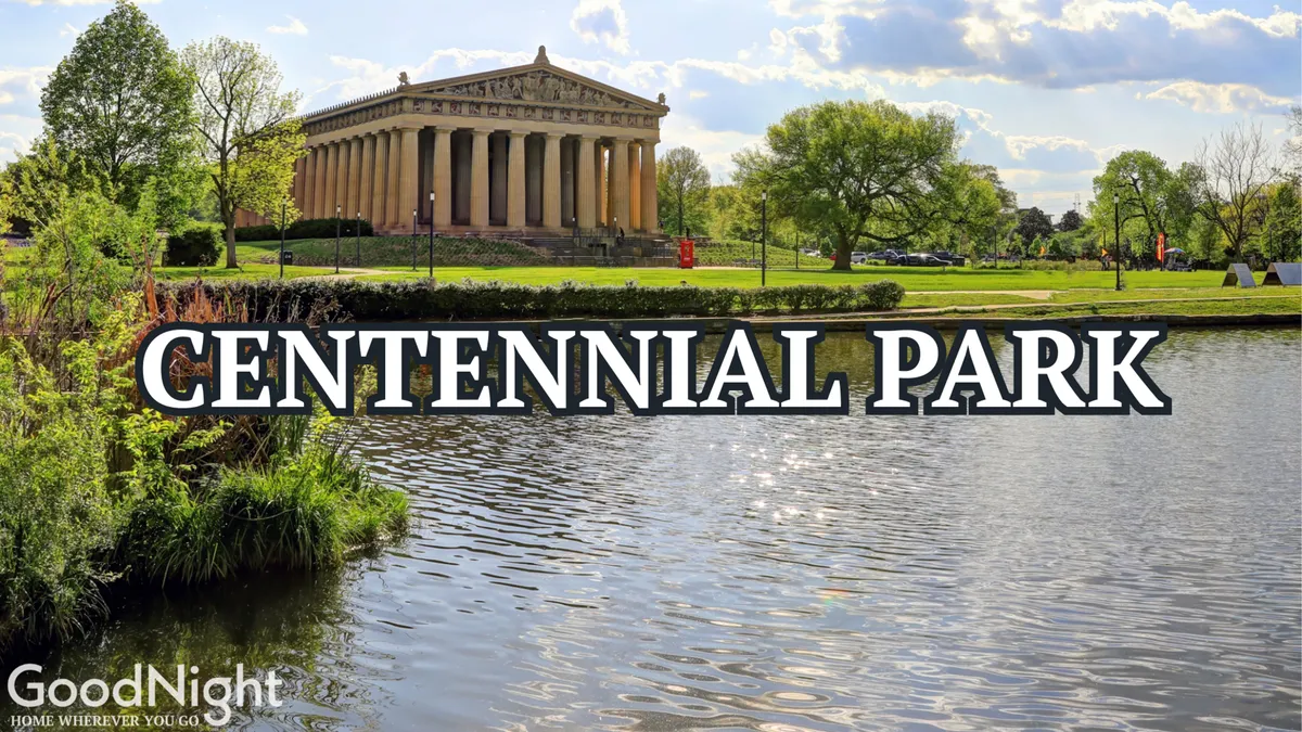 A serene scene of the Parthenon replica in Centennial Park, reflected in calm water and surrounded by lush greenery. The view is tranquil, yet iconic, showing one of Nashville’s most famous landmarks within walking distance.